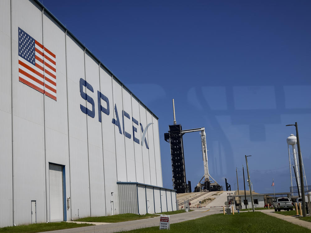 A SpaceX Falcon 9 rocket with the Crew Dragon spacecraft sits on Launch Complex 39A after its launch was scrubbed at the Kennedy Space Center on Friday in Cape Canaveral, Fla.