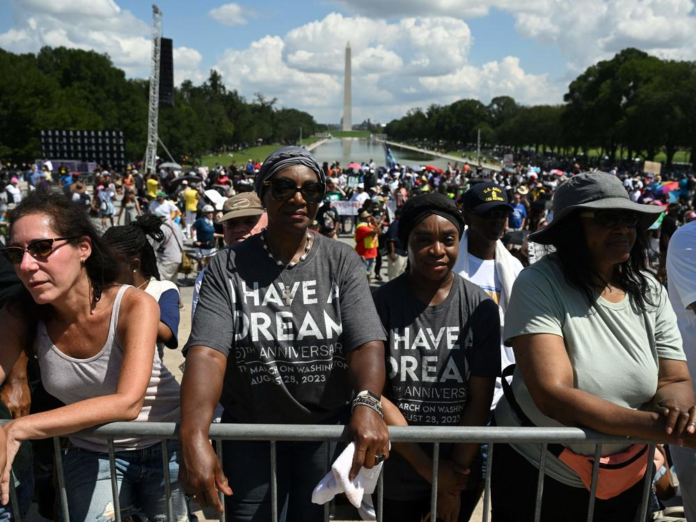 People participate in the 60th anniversary of the March on Washington at the Lincoln Memorial in Washington, D.C., on Saturday.
