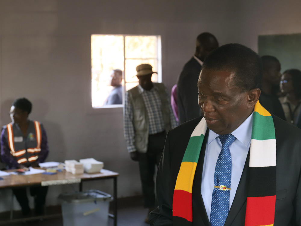 Zimbabwean President Emmerson Mnangagwa attends a polling station to cast his vote, in Kwekwe, Zimbabwe, Wednesday, Aug. 23, 2023.