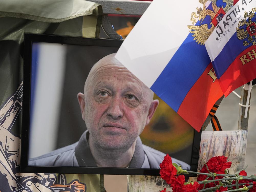 A portrait of the owner of private military company Wagner Group Yevgeny Prigozhin lays at an informal street memorial near the Kremlin in Moscow, Russia, Saturday, Aug. 26, 2023.