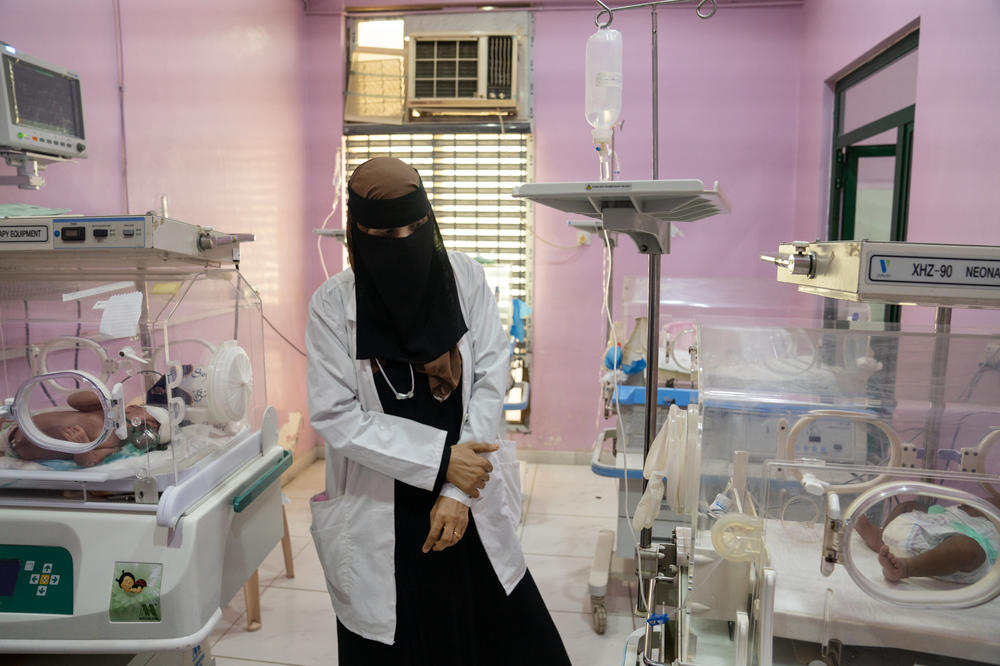 Dr. Manal Abdulhaleem walks through the neonatal intensive care unit at Al-Sadaqa hospital in Aden.