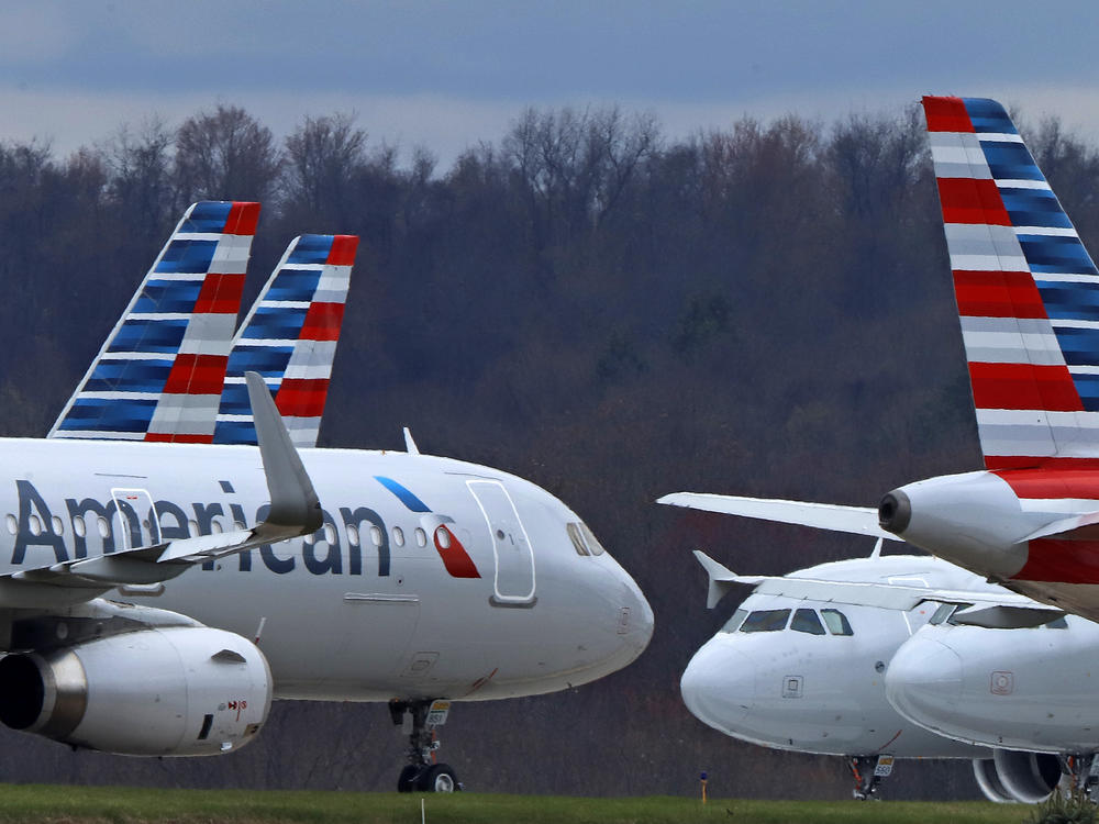 American Airlines planes are shown parked at Pittsburgh International Airport on March 31, 2020, in Imperial, Pa.