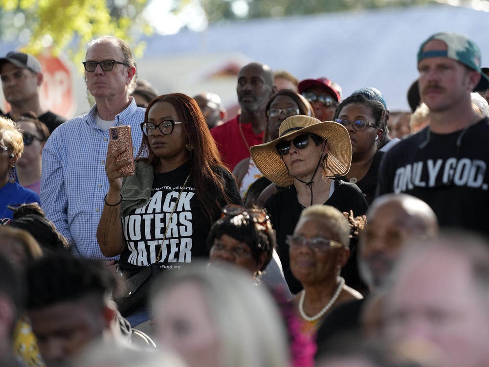 Residents of the Jacksonville community attend a prayer vigil for the victims of Saturday's mass shooting Sunday, Aug. 27, 2023, in Jacksonville, Fla.