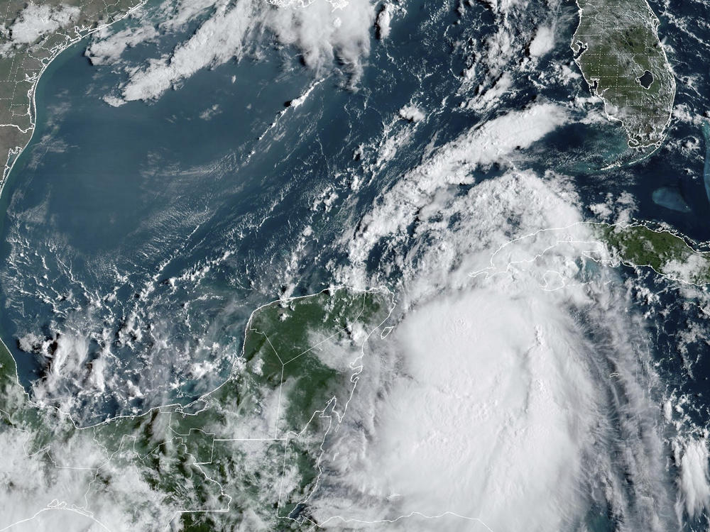 Tropical Storm Idalia moves between Mexico's Yucatan Peninsula, left, and Cuba, right, at 9:40 a.m. ET.