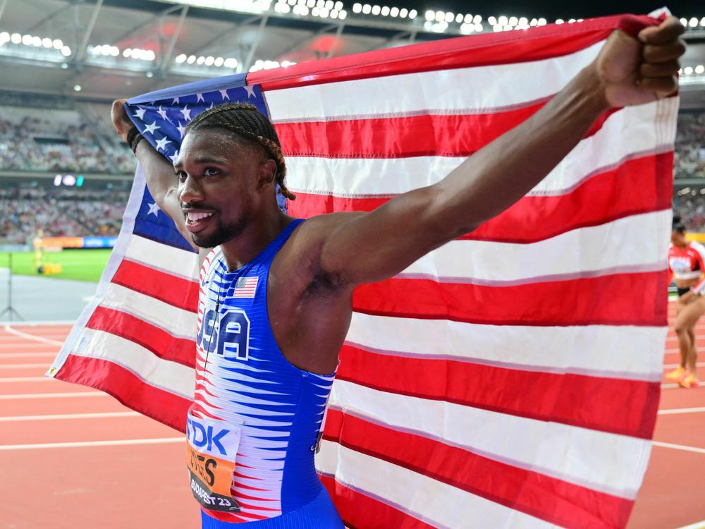 Noah Lyles celebrates after anchoring the USA team to victory in the men's 4x100m relay final during the World Athletics Championships at the National Athletics Centre in Budapest on August 26.