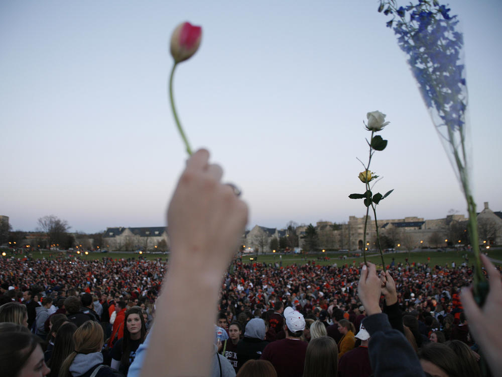 People gather for a vigil after the 2007 Virginia Tech shooting Blacksburg, Va.