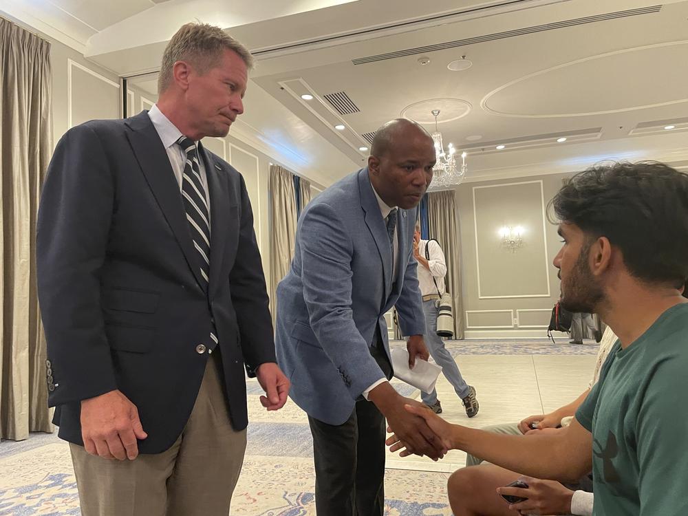 UNC-Chapel Hill Chancellor Kevin Guskiewicz, left, and UNC Chief of Police Brian James console students who had spent hours on lockdown during an active shooter situation on campus on Monday.