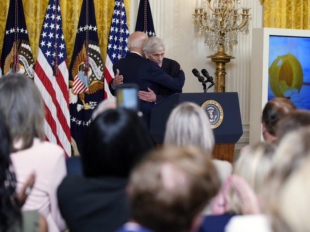 President Biden hugs Steven Hadfield, a Medicare recipient who takes expensive drugs, at an event on prescription drug costs at the White House on Aug. 29.