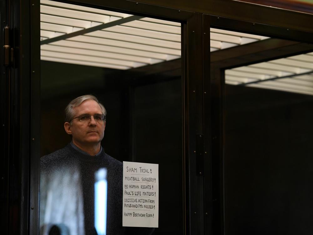 Paul Whelan, a U.S. Marine Corps veteran accused of espionage and arrested in Russia in December 2018, stands inside a defendants' cage as he waits to hear his verdict in Moscow on June 15, 2020.