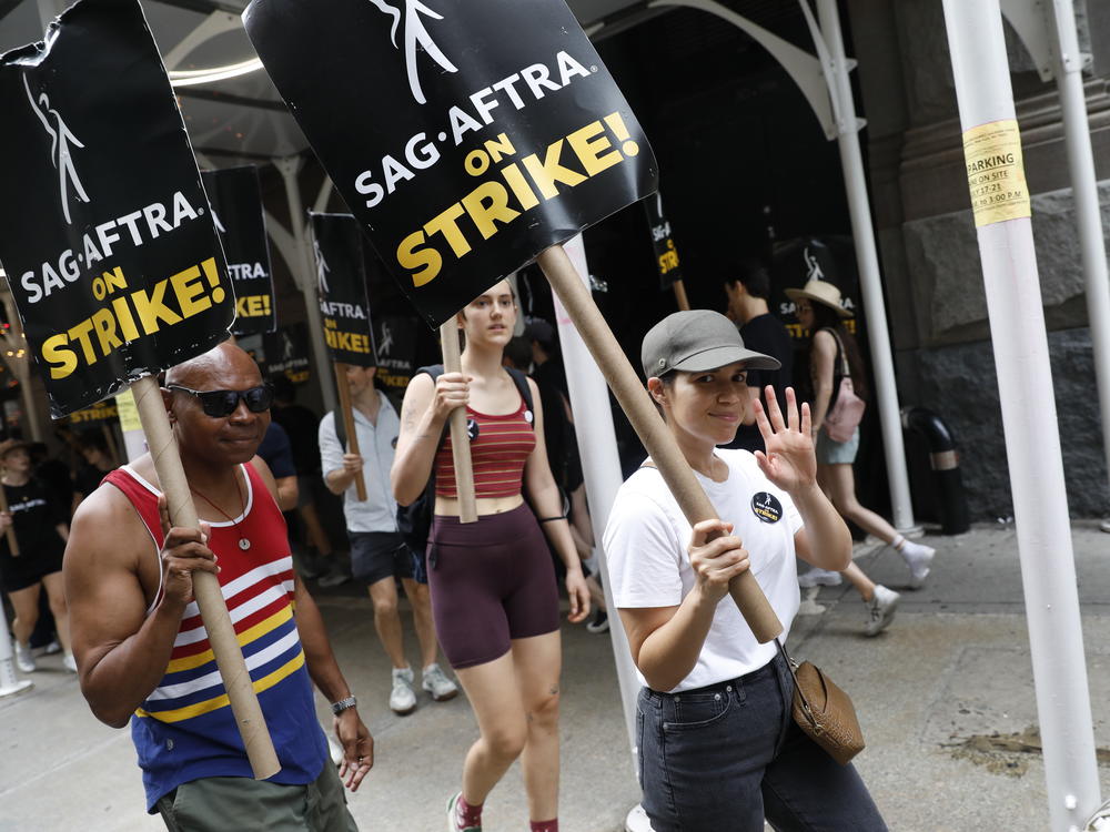 America Ferrera joins the SAG-AFTRA picket line in front of Netflix  in New York City. Actors who qualify get a very good deal on health insurance from their union.