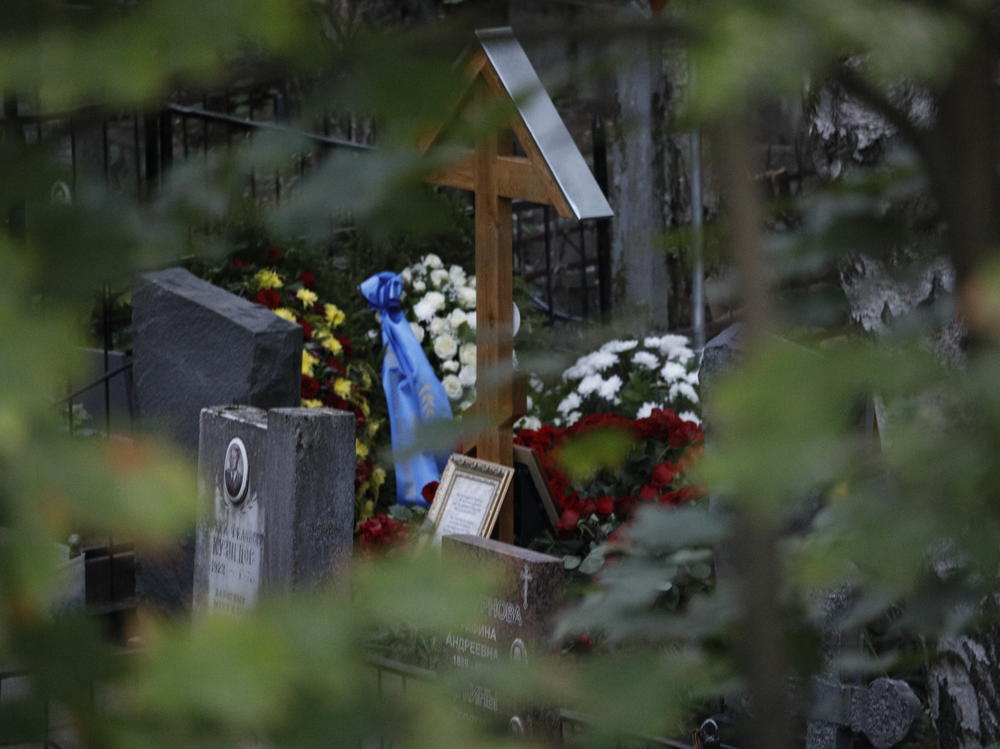 Flowers left on the grave of Yevgeny Prigozhin who died in a plane crash are seen during the funeral ceremony at a cemetery in St. Petersburg, Russia, on Tuesday.