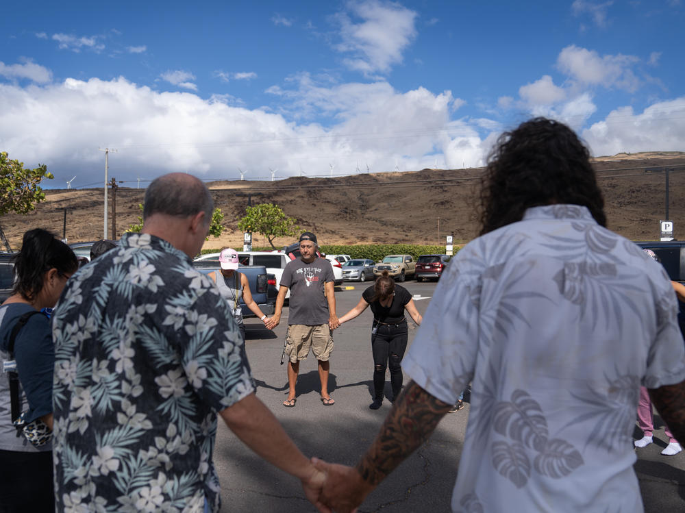 A group of volunteers with Maui Medic Healers Hui gather before heading out to help people affected by the fires in Lahaina.