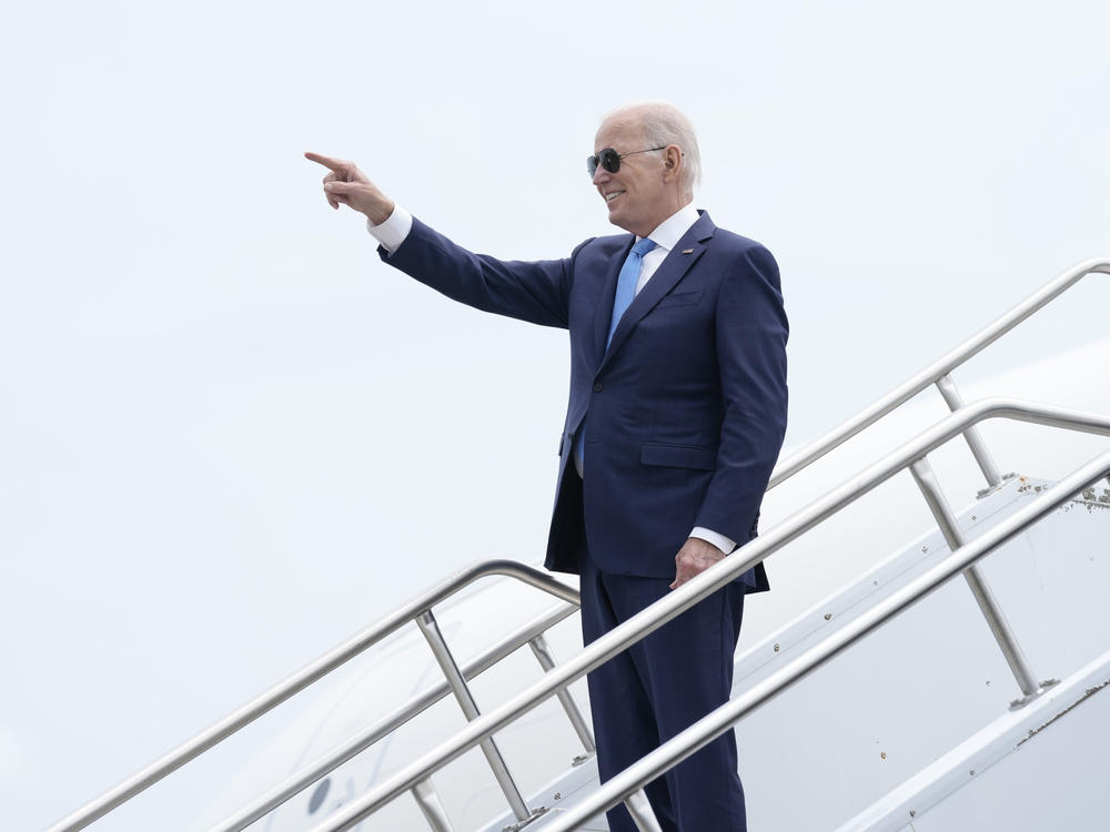 President Biden points as he walks down the steps of Air Force One in Windsor Locks, Conn., on June 16, 2023.
