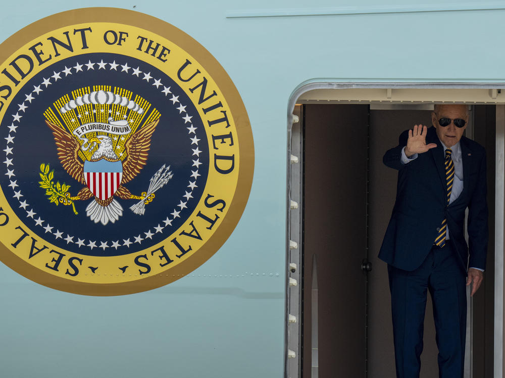 President Biden waves from Air Force One on July 6, 2023 at Andrews Air Force Base, Md., before flying to South Carolina.