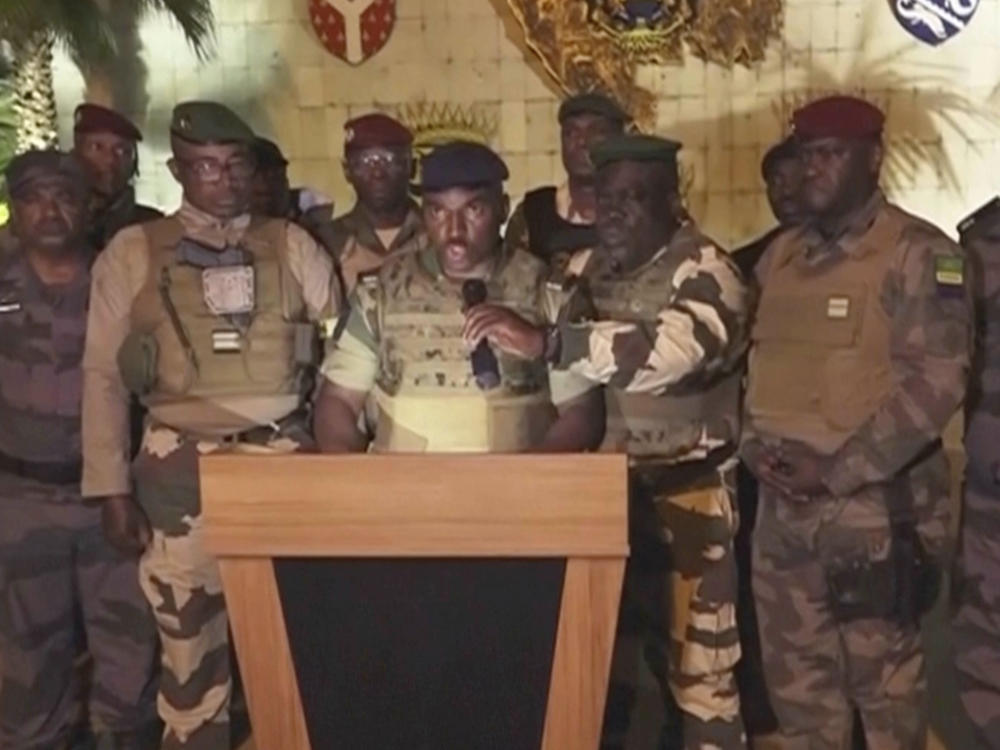 This video grab shoes the spokesperson for the mutinous soldiers speaking on state television as they announce that they had seized power in Libreville, Wednesday Aug. 30, 2023.