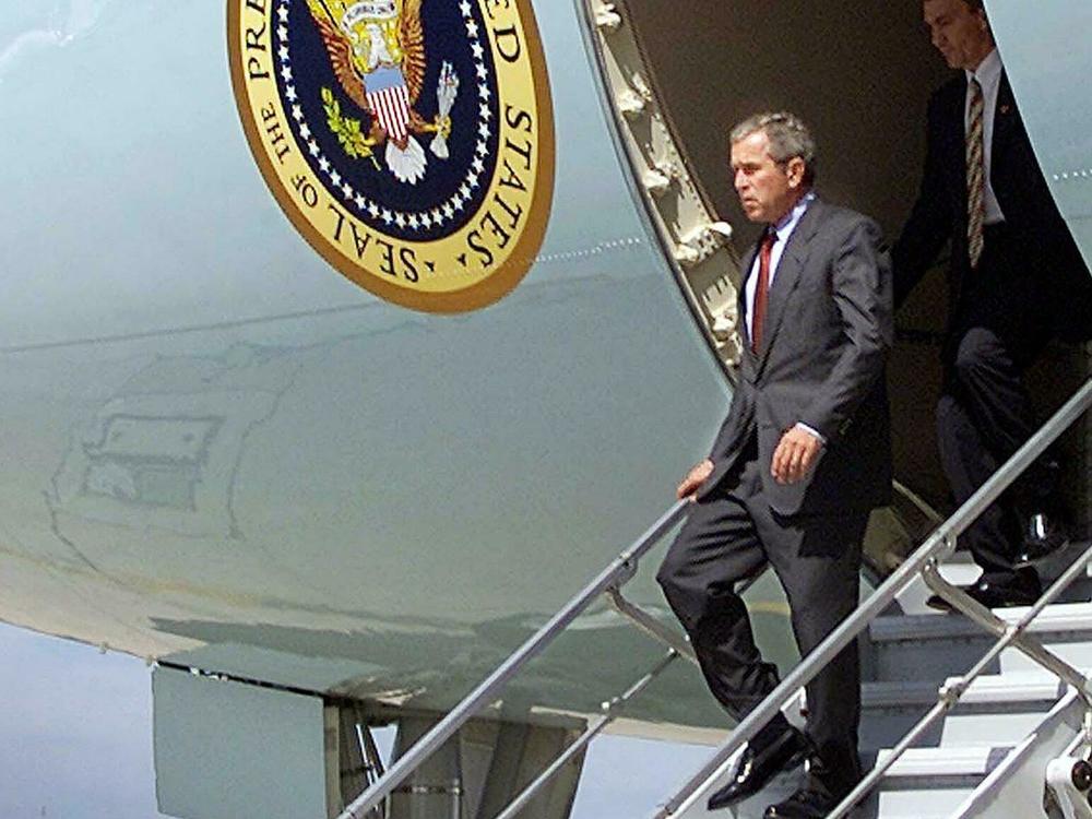 President Bush walks off the steps of Air Force One at Offutt Air Force Base near Omaha, Neb. after two planes crashed into the World Trade Center on Sept. 11, 2001.