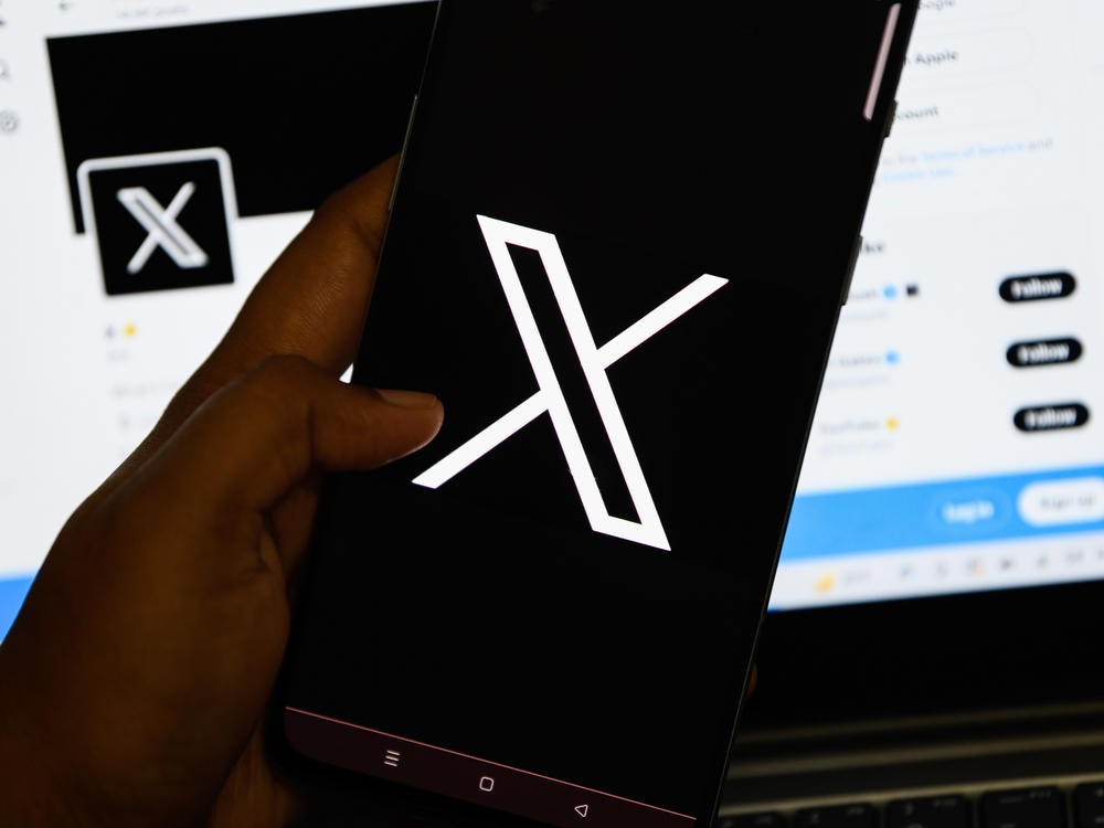 In this photo illustration, the new logo for the social media platform formerly known as Twitter, now X, is seen displayed on a smartphone.
