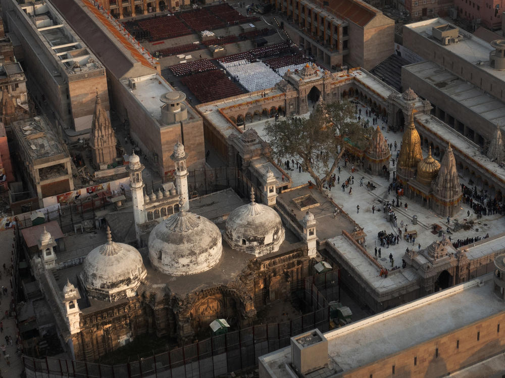 An aerial view shows Gyanvapi mosque (left) and Kashi Vishwanath temple on the banks of the Ganges River in Varanasi, India.