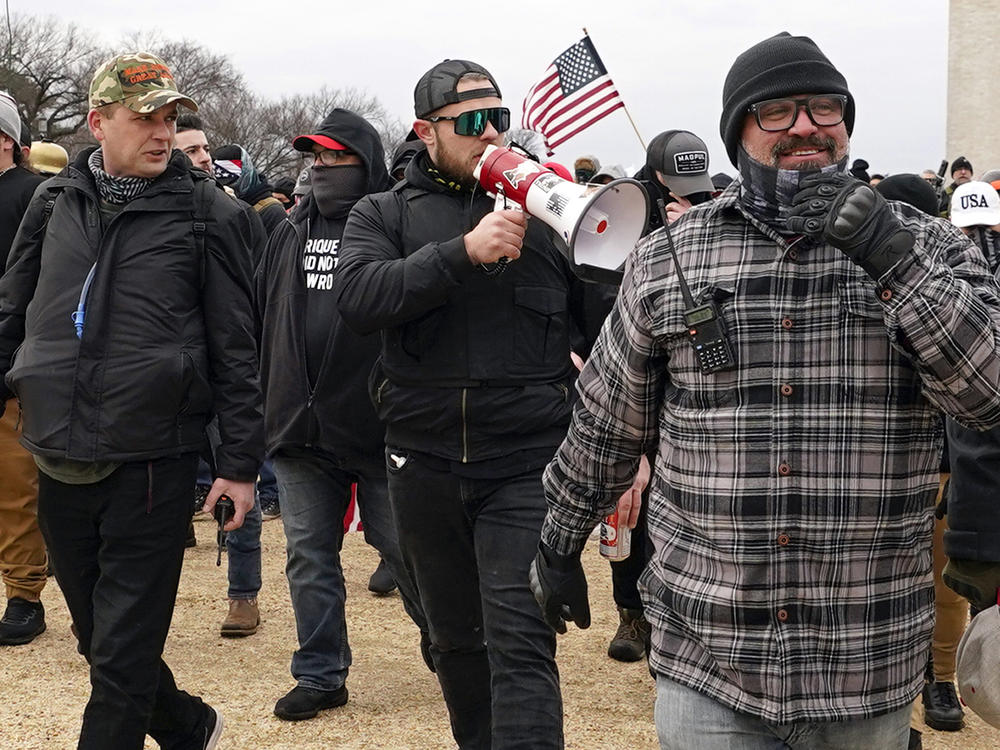 Proud Boys members including Zachary Rehl, left, Ethan Nordean, center, and Joseph Biggs, walk toward the U.S. Capitol in Washington, in support of President Donald Trump on Jan. 6, 2021.
