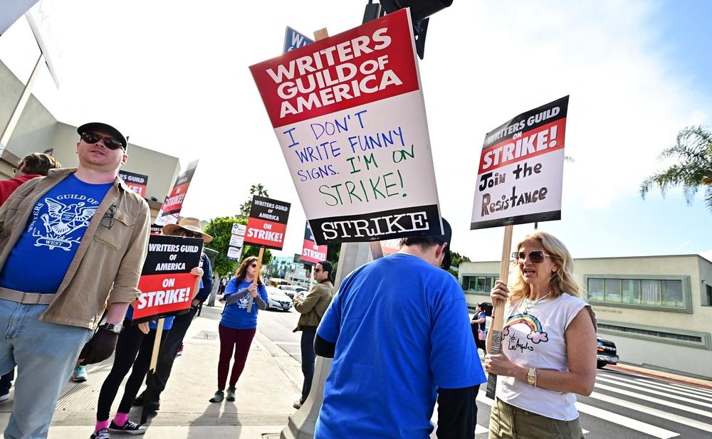 Writers walk the picket line on the second day of the television and movie writers' strike outside of Paramount Studios in Los Angeles on May 3.