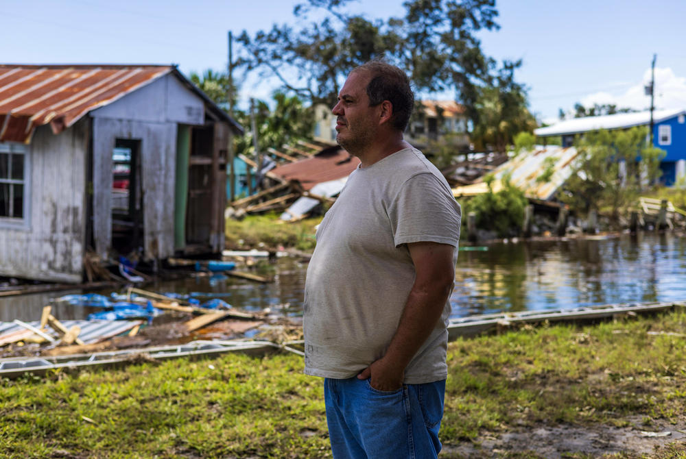 With his family business flattened, and his home here also shredded, Austin Ellison is wondering if it's worth rebuilding at all, or moving on? 