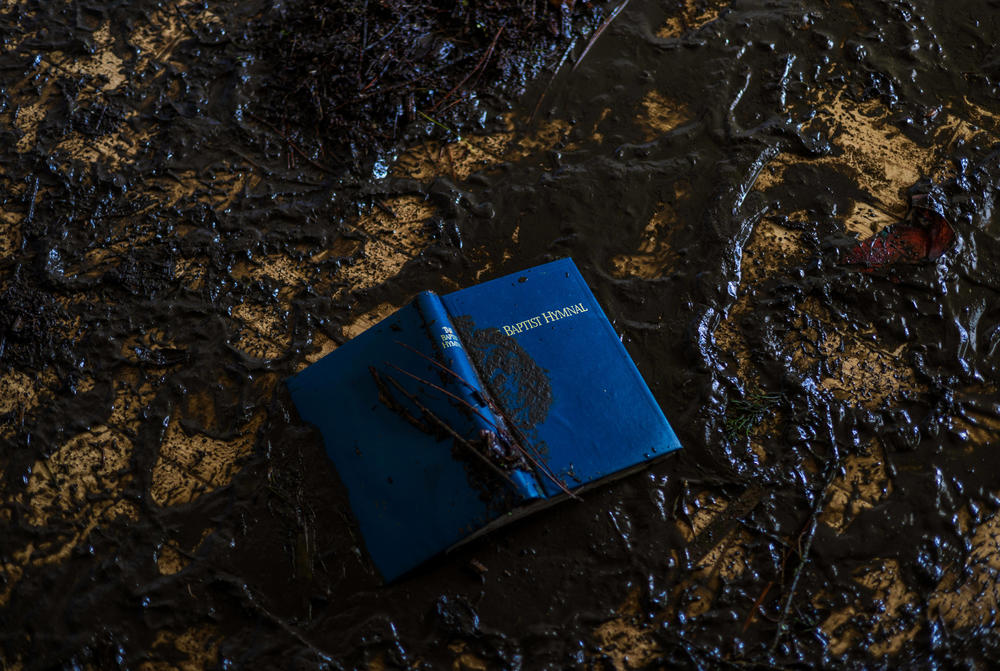 A book of hymns was left on the floor of a church after the hurricane moved through.