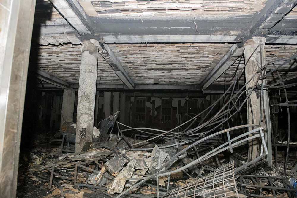 This photo supplied by the South African Government Communications and Information Services shows part of the interior of the ground floor of a building that was gutted by fire, early Thursday.