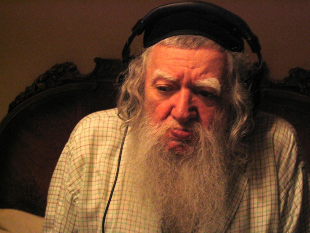 The late Lower East Side mystic Lionel Ziprin listens to a radio documentary.