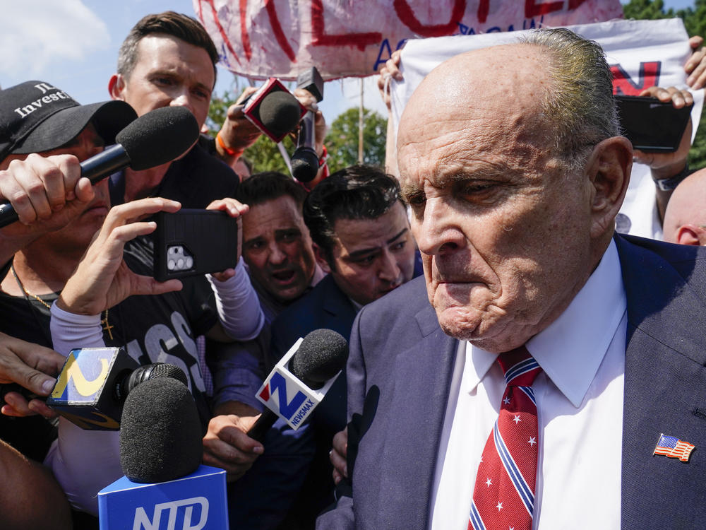 Rudy Giuliani speaks outside the Fulton County jail Aug. 23, in Atlanta. On Friday, he pleaded not guilty to charges that accuse him of trying to illegally overturn the results of the 2020 election in the state.