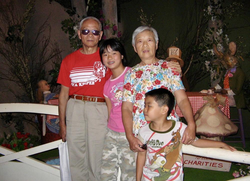 My stylish grandparents with my little brother, Jerry (age 6), and me (age 11) in 2007.