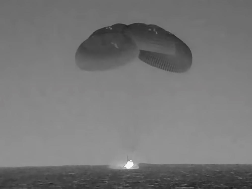 In this image from video made available by NASA, the SpaceX Crew Dragon, slowed by parachutes, splashes down in the Atlantic Ocean off the Florida coast, Monday, Sept. 4, 2023, as it returns to Earth with NASA astronauts Stephen Bowen and Woody Hoburg, United Arab Emirates astronaut Sultan AlNeyadi and Roscosmos cosmonaut Andrey Fedyaev after a six-month stay at the International Space Station.