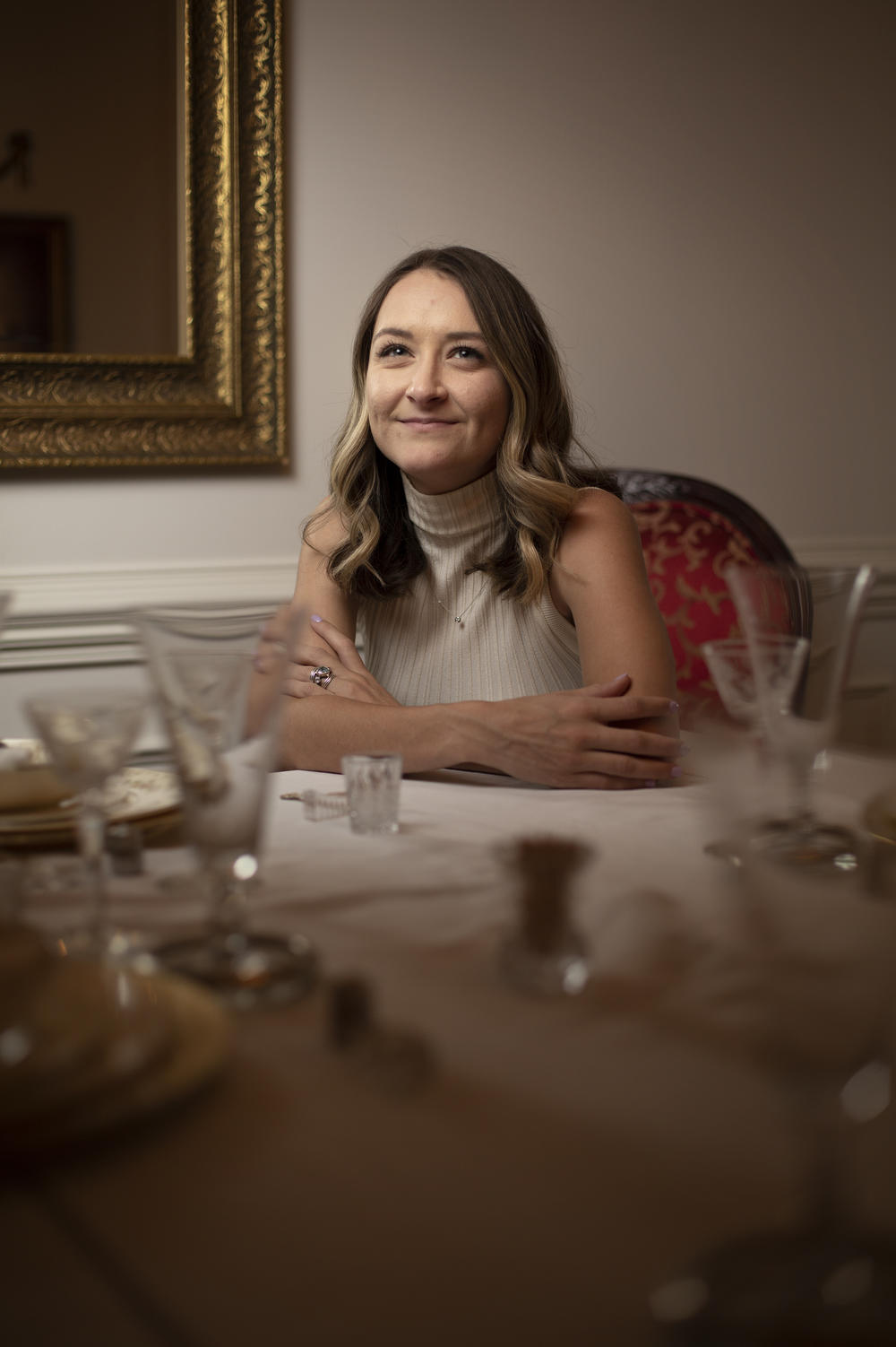 Clayton sits at the dining room table in her parents' Roxboro, N.C., home on June 27. She credits President Biden with federal investments in local communities.