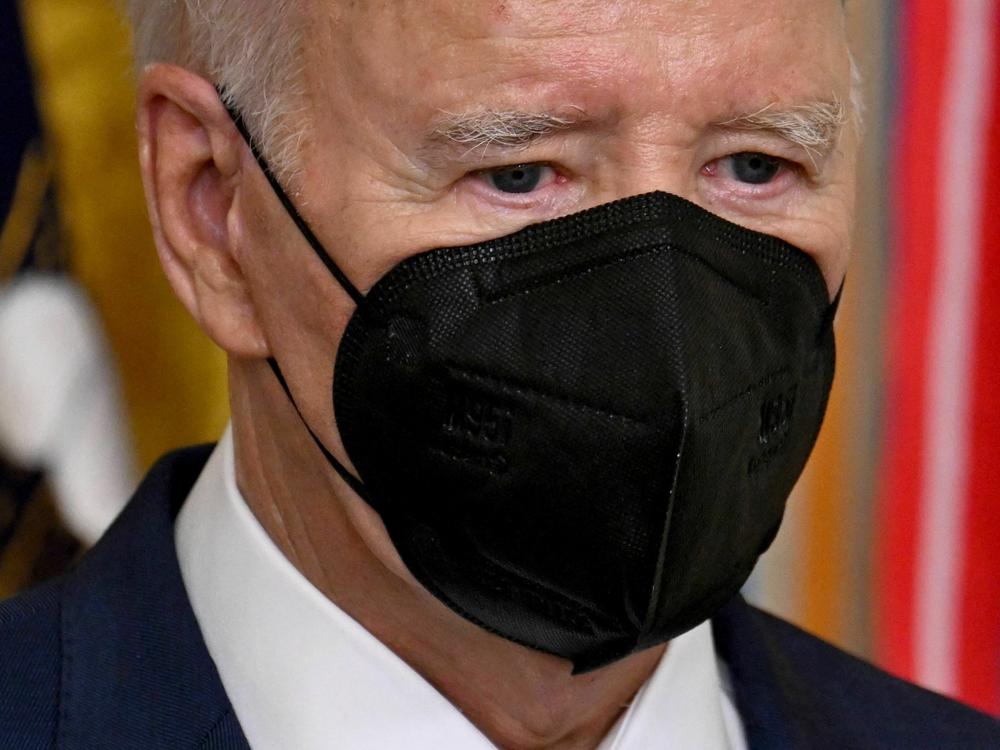 At an East Room event on Monday, President Joe Biden wore a mask as he walked through the crowd to the front of the room, and then he took it off when he began to speak from the lectern.