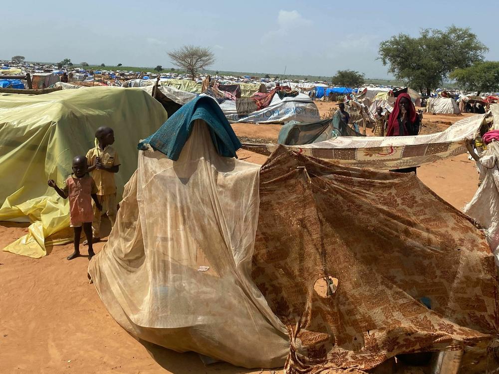 The refugee camp in the Chad town of Adré covers hundreds of yards filled with small dwellings and huts.