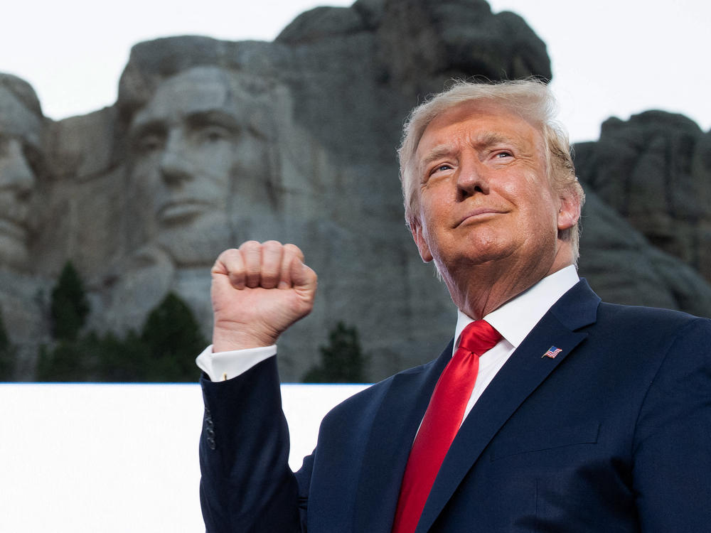 Former President Donald Trump pumps his fist at Mount Rushmore National Memorial in Keystone, South Dakota, July 3, 2020.
