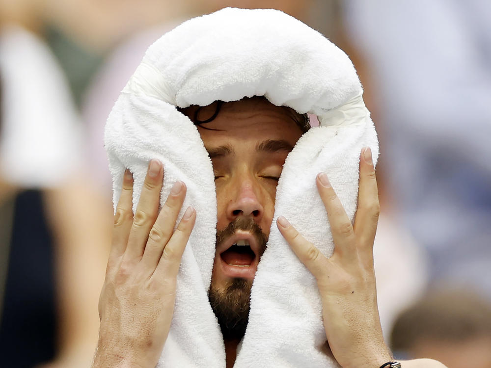 Daniil Medvedev cools down against Andrey Rublev of Russia during their men's singles quarterfinal match.