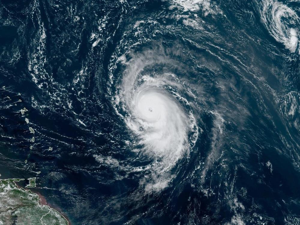 Hurricane Lee formed a well-defined eye wall on Thursday. The storm is seen here in a satellite image from around noon ET Thursday, showing the Leeward Islands and Puerto Rico to the west.