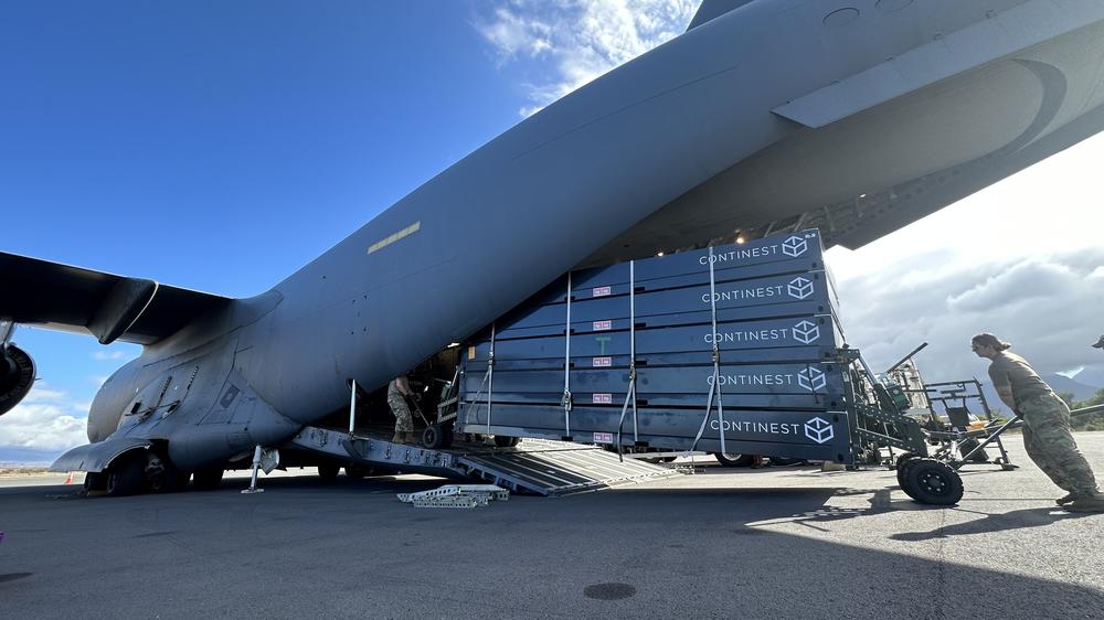 A stack of Continest pop-up buildings arrives in Maui on a C-17 military cargo plane, after the company and a number of agencies worked through a number of logistical hurdles.