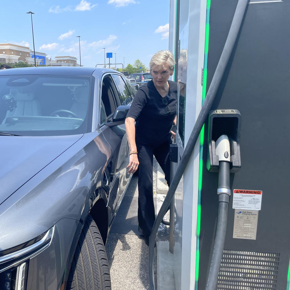 Granholm approaches a charging station to charge the Cadillac Lyriq she was riding during a four-day road trip through the southeast early this summer. The electric vehicle had charging problems due to an 