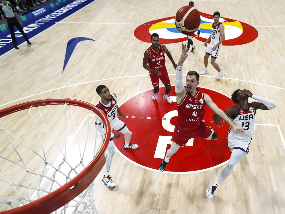 Germany's Andreas Obst drives to the basket against Team USA in the FIBA Basketball World Cup semifinals Friday. Germany upset the U.S. 113-111, and will take on Serbia this Sunday in its first-ever championship game.