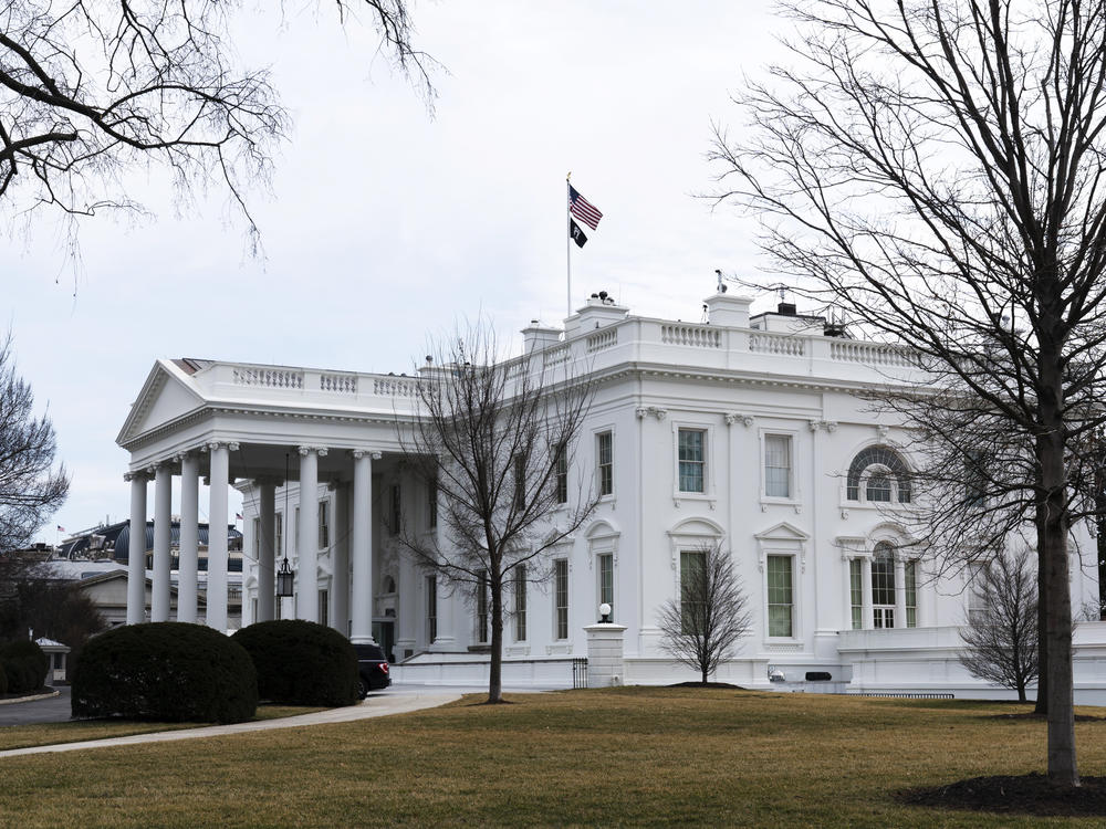 An American flag flies on top of the White House, Feb. 12, 2022, in Washington. A federal appeals court Friday, Sept. 8, 2023, significantly whittled down a lower court's order curbing Biden administration communications with social media companies over controversial content about COVID-19 and other issues.