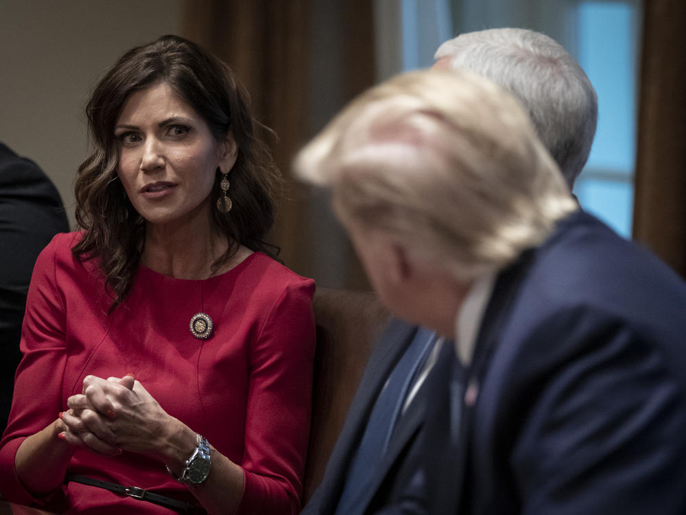 South Dakota Gov. Kristi Noem speaks as U.S. President Donald Trump listens during a meeting in the White House on Dec. 16, 2019 in Washington, D.C.
