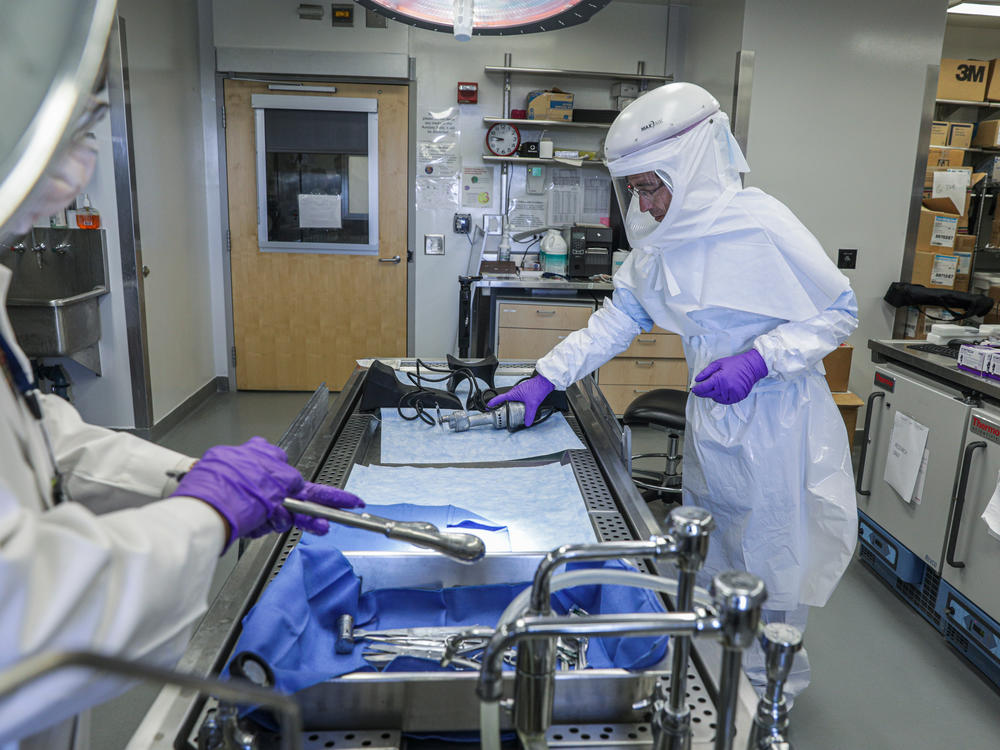 Researchers looking for root causes of long COVID work in the autopsy suite inside the Clinical Center at the National Institute of Health in Bethesda, Maryland.