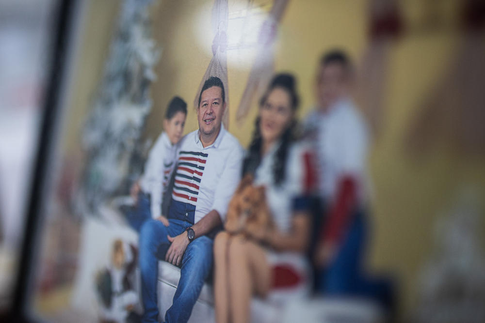Molina, pictured with his family, moved with his wife and two young children to the provincial capital of Florencia last year after rebels threatened to bomb the town hall.
