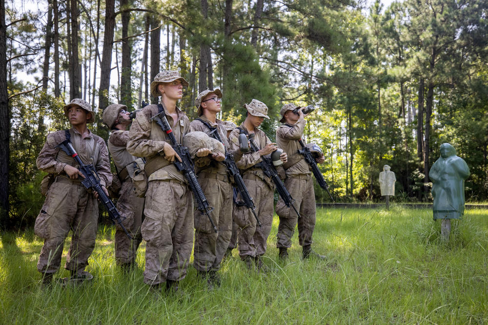 Marine recruits with November Company 3rd Recruit Training Battalion wait for instruction after completing the day movement course at Marine Corps Recruit Depot, Parris Island on August 22 in Beaufort County, S.C.