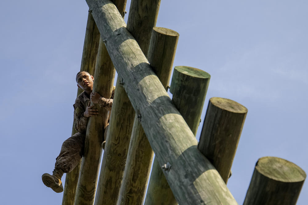A Marine recruit with Kilo Company 3rd Recruit Training Battalion climbs a 30-foot ladder during an obstacle in Leatherneck Square at Marine Corps Recruit Depot, Parris Island on August 22 in Beaufort County, S.C.
