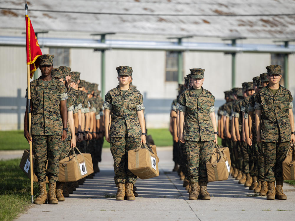 Marine recruits wait for their drill instructor as they cross the base at Marine Corps Recruit Depot, Parris Island on August 22 in Beaufort County, S.C.