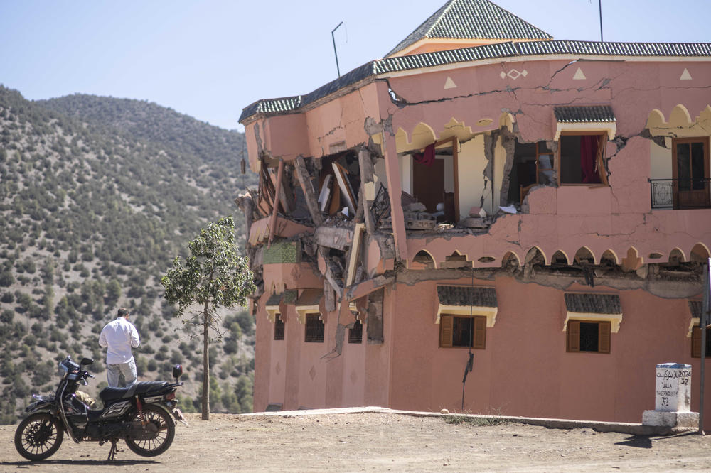 A man stands next to a damaged hotel after the earthquake in Moulay Brahim village, near the epicentre of the earthquake, outside Marrakech, Morocco.