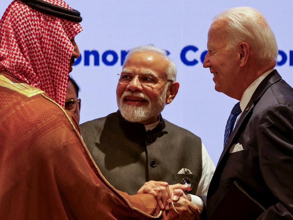 President Biden shakes hands with Saudi Arabia's Crown Prince Mohammed bin Salman and India's Prime Minister Narendra Modi after announcing a new corridor to link India to the Middle East and Europe.