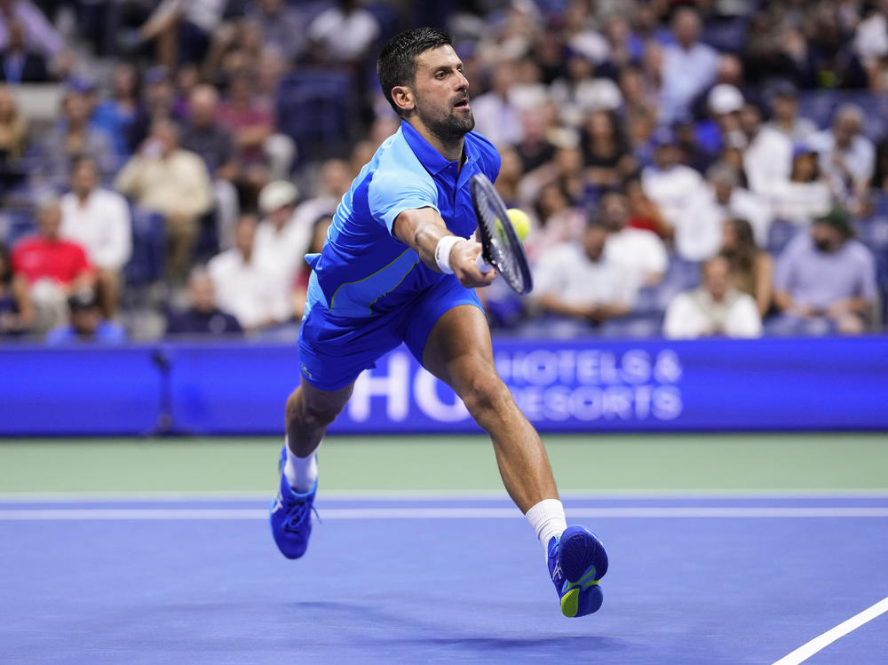 Novak Djokovic, of Serbia, returns a shot to Daniil Medvedev, of Russia, during the men's singles final of the U.S. Open tennis championships, on Sunday in New York.